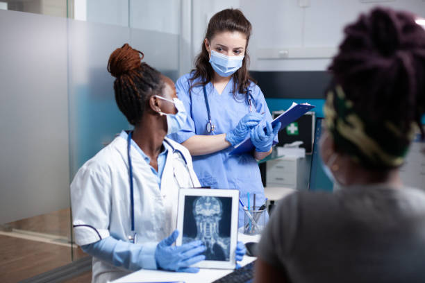 istock Doctor and nurse discussing treatment 1489369629