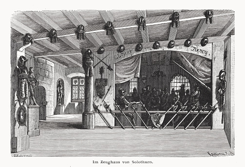 Historical view the arsenal chamber of Solothurn, Switzerland. It is today a museum (Old Arsenal Museum). Wood engraving after a drawing by Julius Zimmermann (German painter, 1824 - 1906), published in 1877.