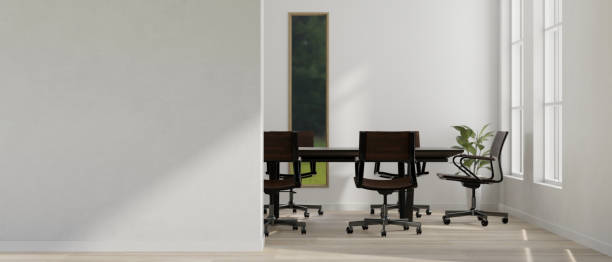 istock A modern white meeting room with meeting table and empty mockup white wall. 1489373750