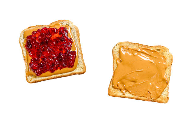 istock Peanut butter sandwich  toast with berry jam.   Isolated on white background. 1489376759