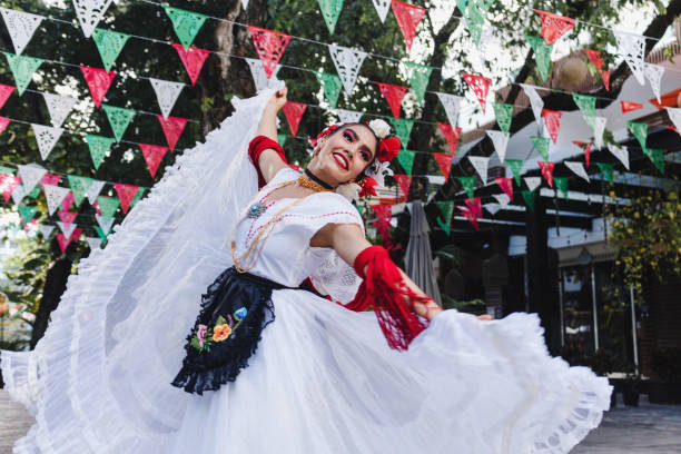 latin woman wearing traditional mexican dress traditional from veracruz mexico latin america, young hispanic people in independence day or cinco de mayo parade or cultural festival - veracruz imagens e fotografias de stock