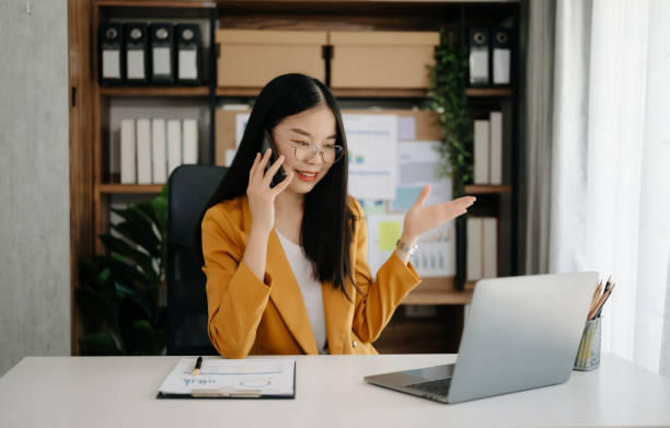 istock Asian businesswoman working in the office with working notepad, tablet and laptop documents in office 1489379623