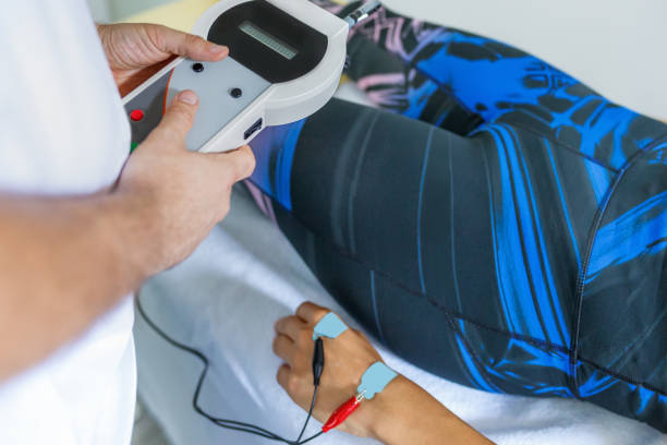 istock Using instrument with monitor for adjusting electrostimulation in sports therapy 1489383991