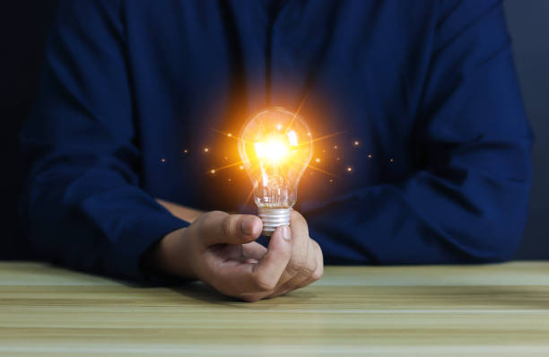 istock The concept of a light bulb on a businessman computer 1489384312