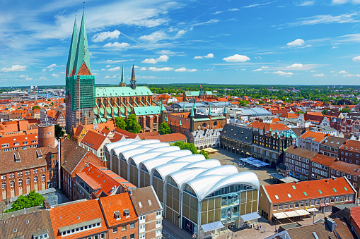 Aerial view of Lübeck Old Market Square surrounded by St. Mary's Church and Town Hall