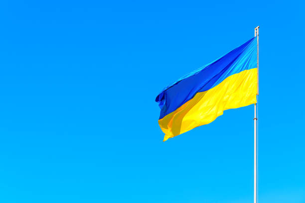 istock Ukrainian National Flag in Blue Sky 1489387844