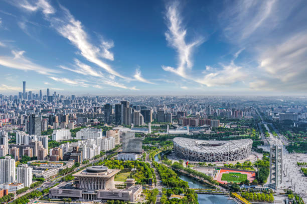 September 28, 2023 - Beijing, China: Beijing National Stadium, known as the Bird's Nest, standing illuminated at night, showcasing its distinctive steel lattice architecture as a prominent landmark and cultural symbol of China