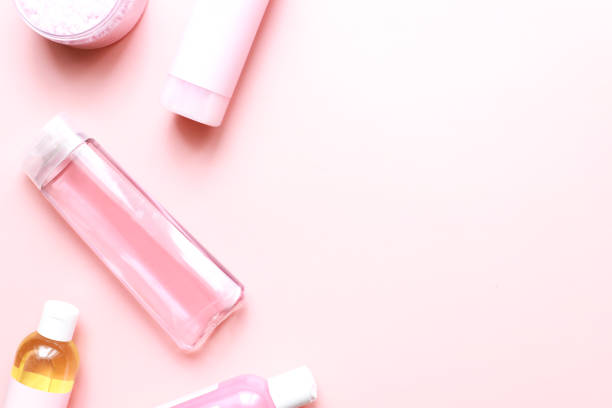 istock Flat lay beauty on a pink background. Glamor cosmetics. spa bottle mockup 1489391124