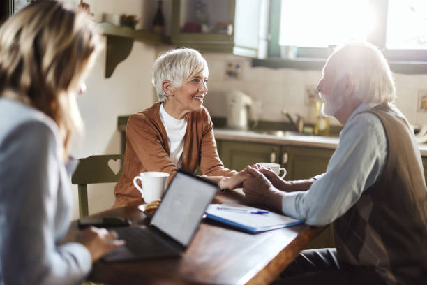 istock Meeting with life insurance agent at home! 1489391825