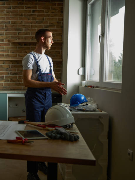 istock Pensive manual worker inside of the apartment. 1489393188