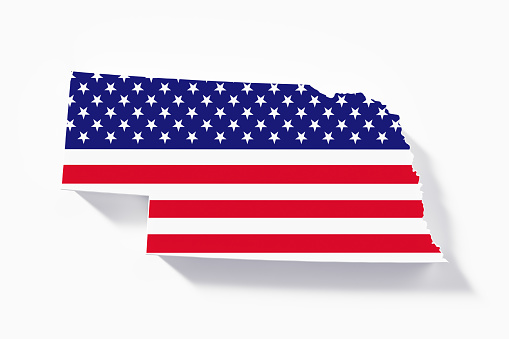 State border of Nebraska textured with American flag on white background. Horizontal composition with copy space.