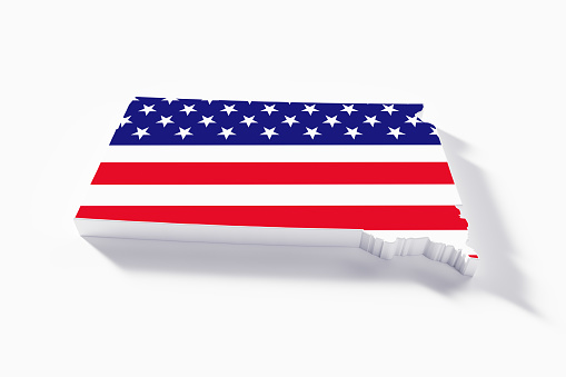 A beautiful miniature Vermont desk flag isolated on a white background. The little pennant is elegantly attached to a small wooden flag stand.