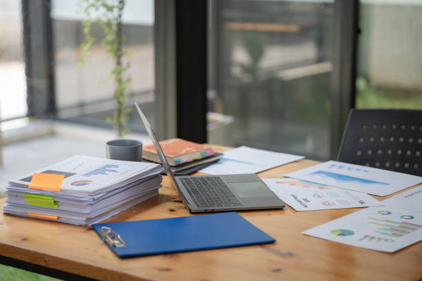 istock A laptop with charts and reports on office desk workplace. 1489394808