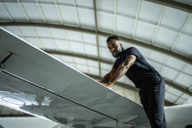 portrait of a airplane in the airport hangar - fixed wing aircraft imagens e fotografias de stock