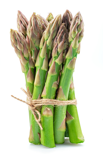 Bundle of green asparagus spears isolated on white background.