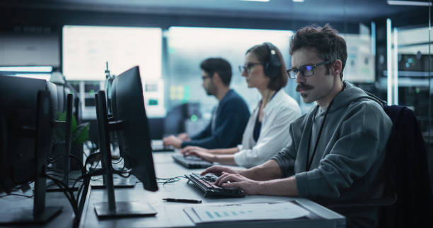 istock Portrait of a Focused Computer Engineer Working in a Technological Office Facility. Research and Development Department Writing Software Code for an Innovative Online Program for a Global Enterprise 1489403708