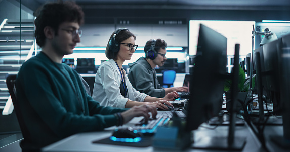 software developer using computer for artificial... Team Of Diverse Multiethnic Software Developers Working On Computers ...
