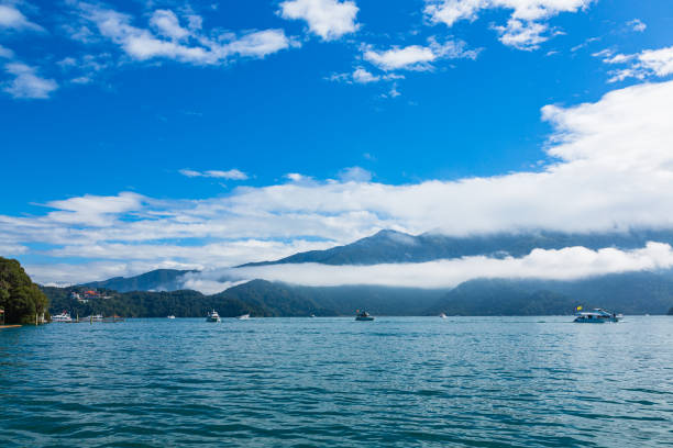 Sun Moon Lake is a beautiful freshwater lake located in the mountains of central Taiwan, near the city of Taichung. It is one of the most popular tourist destinations in Taiwan, known for its scenic beauty, cultural significance, and outdoor activities.