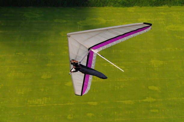 istock Hang glider pilot playing with his wing in the air. 1489412678