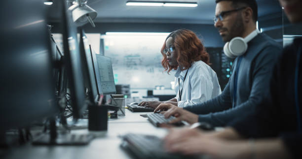 istock Portrait of a Thoughtful Black Female Engineer Working on Computer in a Technological Office Environment. Research and Development Department Writing Software Code for an Innovative Internet Project 1489413232