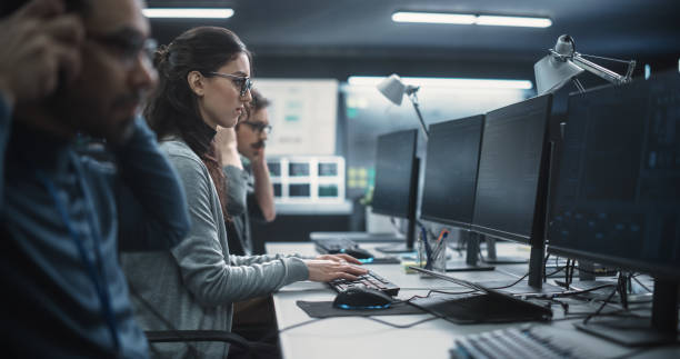 istock Portrait of a Thoughtful Female Engineer Working on Computer in a Technological Office Environment. Research and Development Department Writing Software Code for an Innovative Internet Project 1489413825