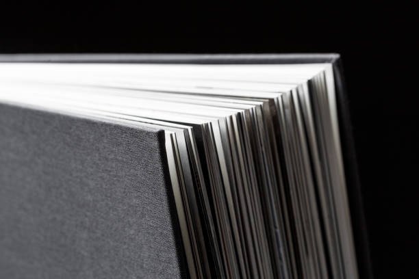 istock Corners of a black textile book cover close up. 1489414343