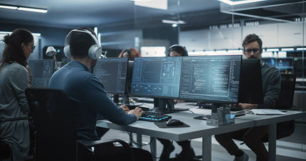 istock Team of Talented Young Professionals Working in a Technological Research and Development Agency. Young Female Developer Working with AI Software and Mapping Technical Neural Network Data Set 1489414741