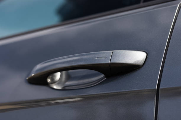 istock Car door handle with unlock button. Keyless entry car door handle with touch sensor. Access button. Modern car. Car security concept 1489415383