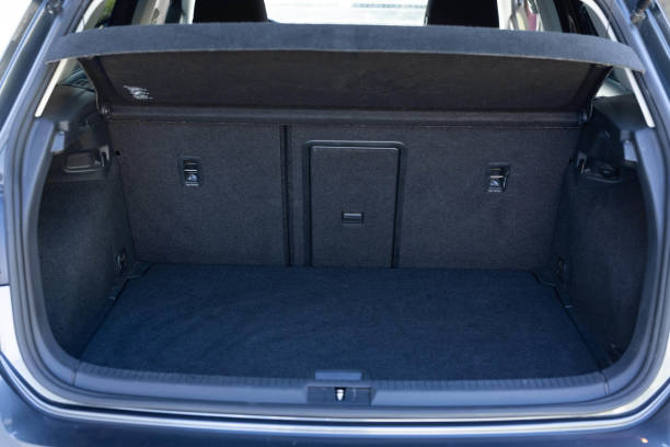 istock Rear view of the car open trunk. Modern hatchback car with open empty trunk. The car boot is open for luggage. A lot of space for coffers and bags. Ready for a trip. 1489416659