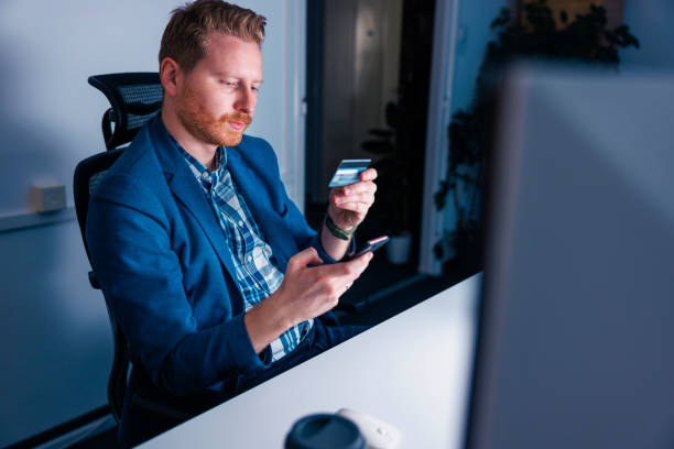 istock Businessman doing online payment using credit card 1489416777