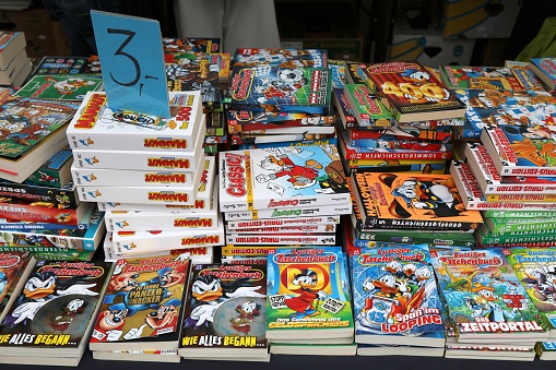 Donald Duck and other Disney comic books in German language at Altstadtsauber flea market in Klagenfurt, Austria.