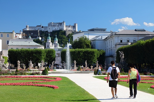 People visit Mirabell Garden in Salzburg, Austria. Salzburg Old Town is a UNESCO World Heritage Site.
