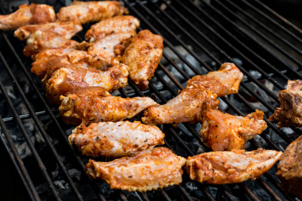 istock Marinated raw meat just put on the barbecue, chicken and ribs 1489417715