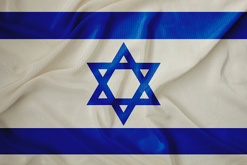 Israeli national flag on corrugated paper, ready for your grunge effects to be applied.