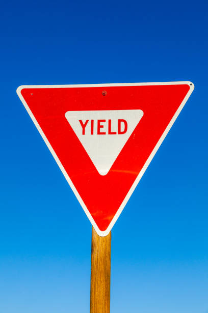 istock yield Sign at the highway with blue sky 1489421093