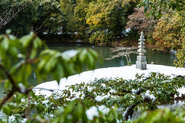 a snow-snowed white snake mound in shikuon-ji temple in kyoto, japan - kyoto city kyoto prefecture kinkaku ji temple temple imagens e fotografias de stock