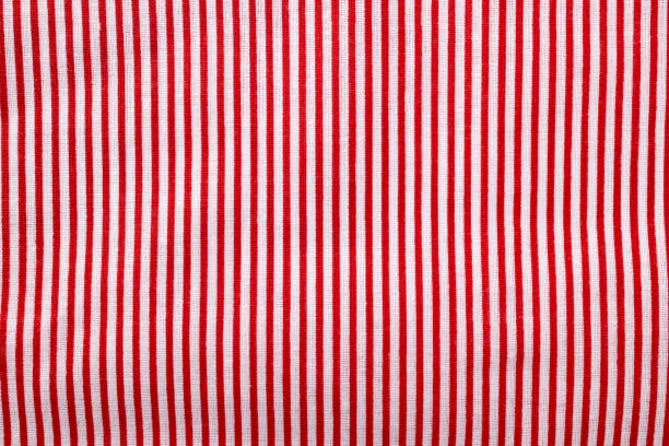 istock Red and white striped cotton texture, fabric textile background 1489421550