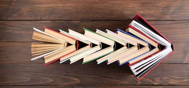 Arrow Shape made of books - love to wisdom, science and education. Reading and writing concept
