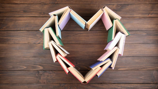 Heart shape stacked of books - love to wisdom, science and education concept stock photo