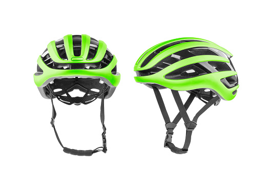 Set of green bicycle helmets with side, front views. Isolated on white background.