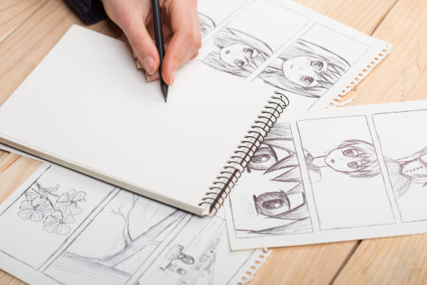 istock Artist drawing an anime comic book in a studio. 1489425366
