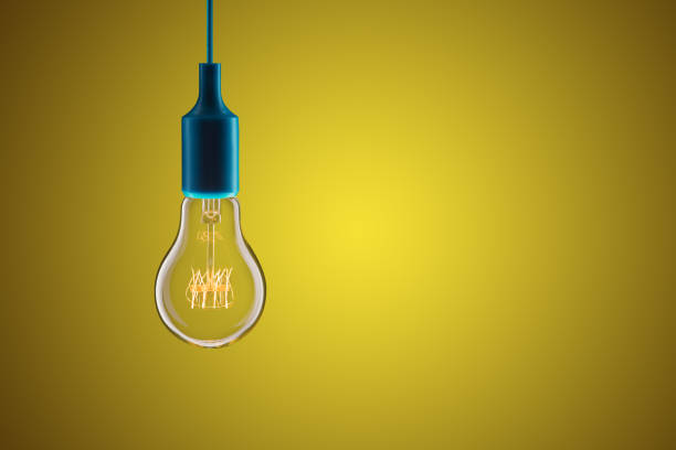 istock Idea and leadership concept - bulbs on the yellow background 1489427499