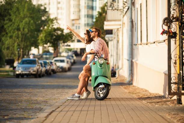 istock Vacationing couple and motor scooter 1489429390