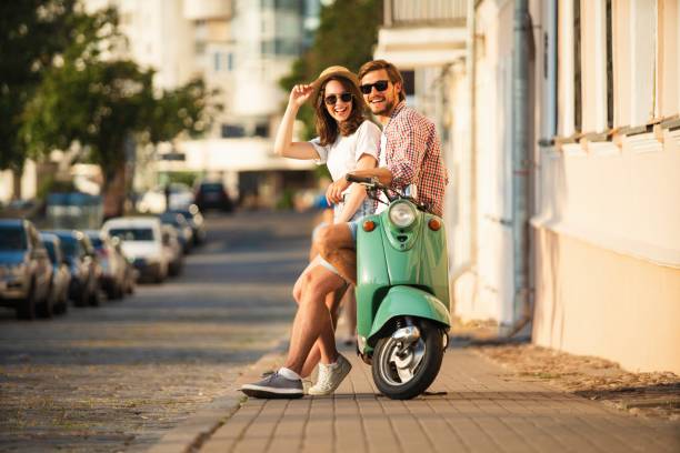 istock Vacationing couple and motor scooter 1489429555