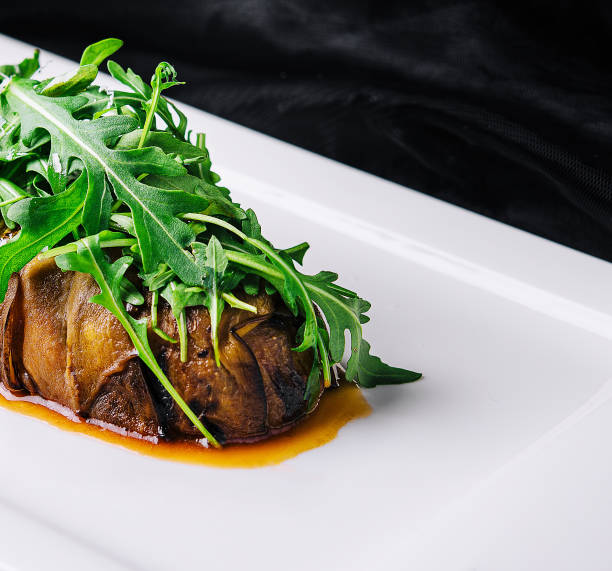 istock Baked eggplant with arugula and grated parmesan cheese 1489430182