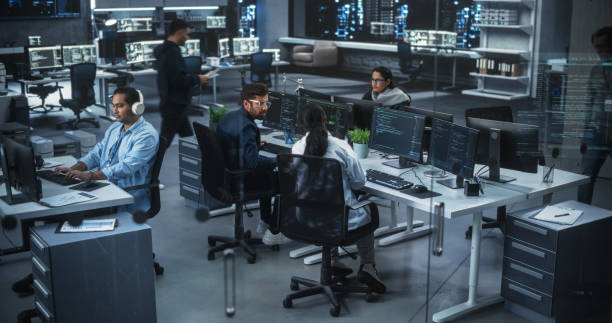 istock Team of Talented Young Indian Professionals Working in a Technological Research and Development Agency in South Asia. Computer Screens with Software Code and Artificial Intelligence Projects 1489432184