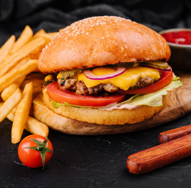 istock Burger, hamburger with french fries cutting board 1489432596