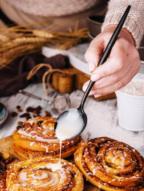 istock Homemade raisin roll pastry with vanilla icing 1489433345