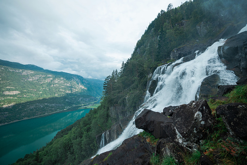 Scenic view of powerful Eidesfossen  waterfall  in mountains in Norway