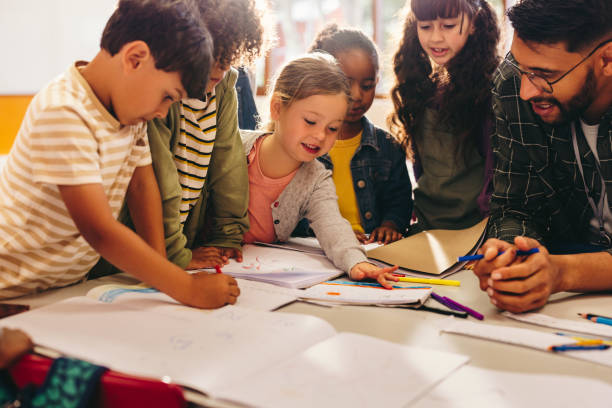 istock Group of children doing an art project with their teacher 1489441216